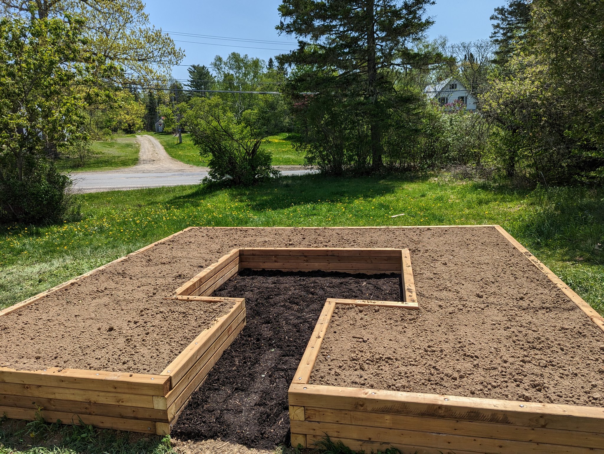 Flowerbox filled with soil around the central access path