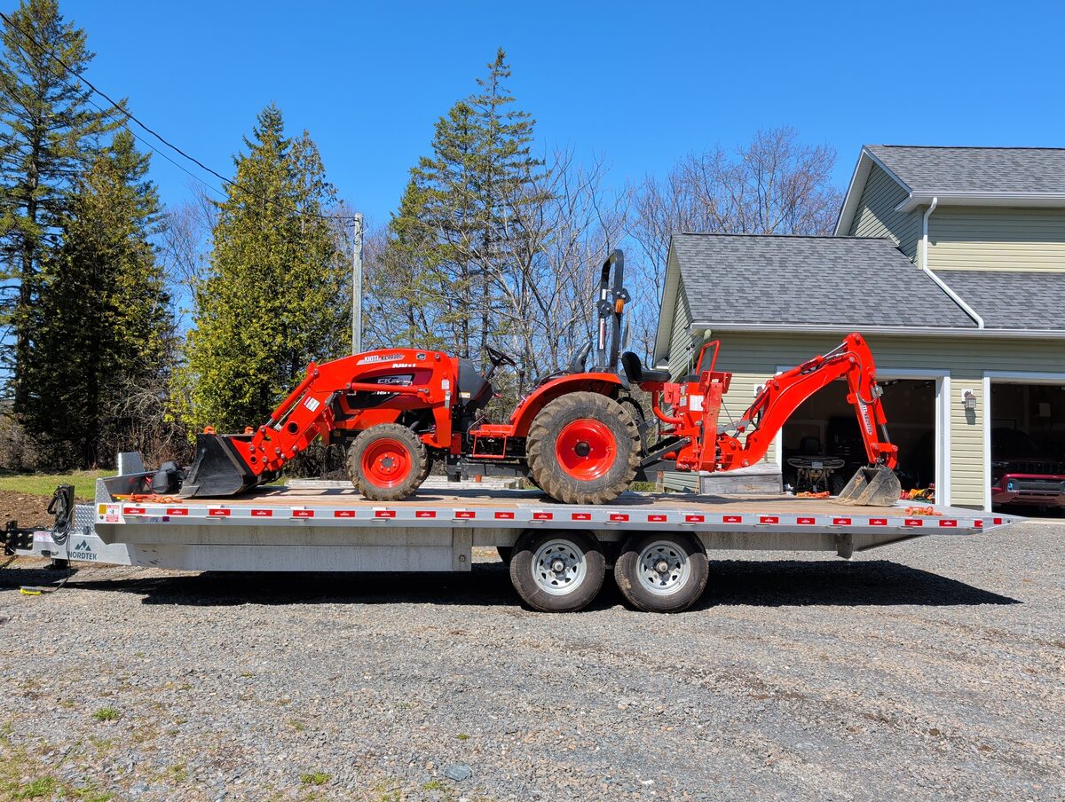 Tractor on flatbed trailer