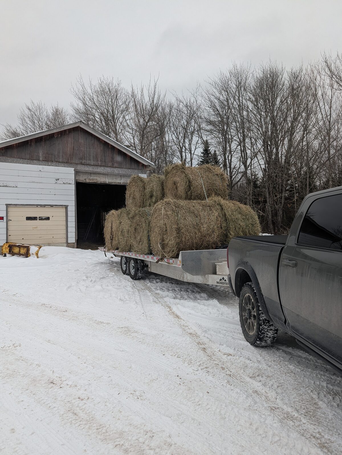 Hay loaded on flatbed trailer