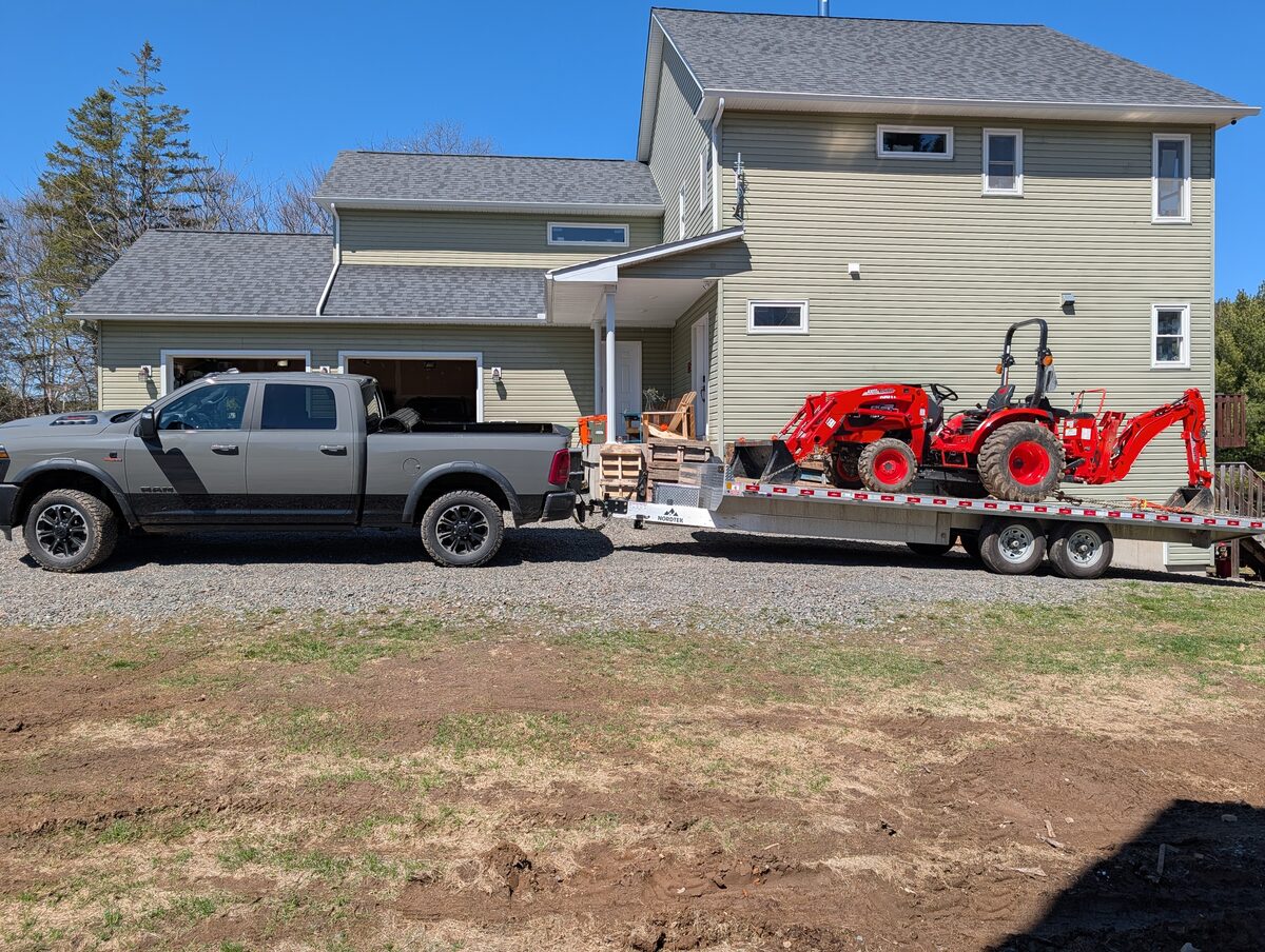 Tractor loaded on flatbed trailer